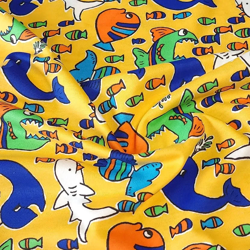 Cotton T-Shirt Stretch Knit Fabric, Colorful Whales, Sharks, and Fish. Lightweight 2-Way Stretch Cotton Blend Fabric. Sold by the 1/2 yard