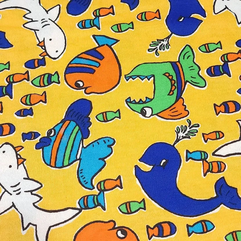 Cotton T-Shirt Stretch Knit Fabric, Colorful Whales, Sharks, and Fish. Lightweight 2-Way Stretch Cotton Blend Fabric. Sold by the 1/2 yard