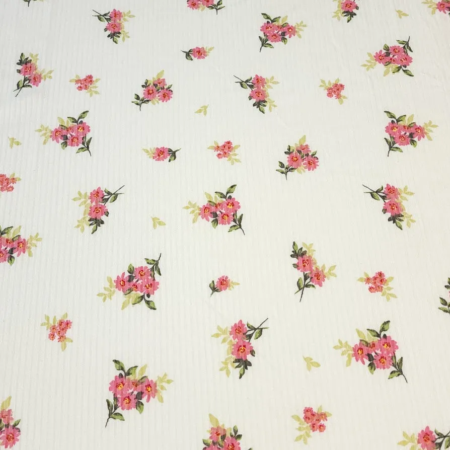 Ribbed Knit Fabric: 4x2 Rib Knit . Cute Ivory with Petite and Pretty Pink Flowers with Green Leaves. 4-Way Stretch, Sold by the 1/2 yard